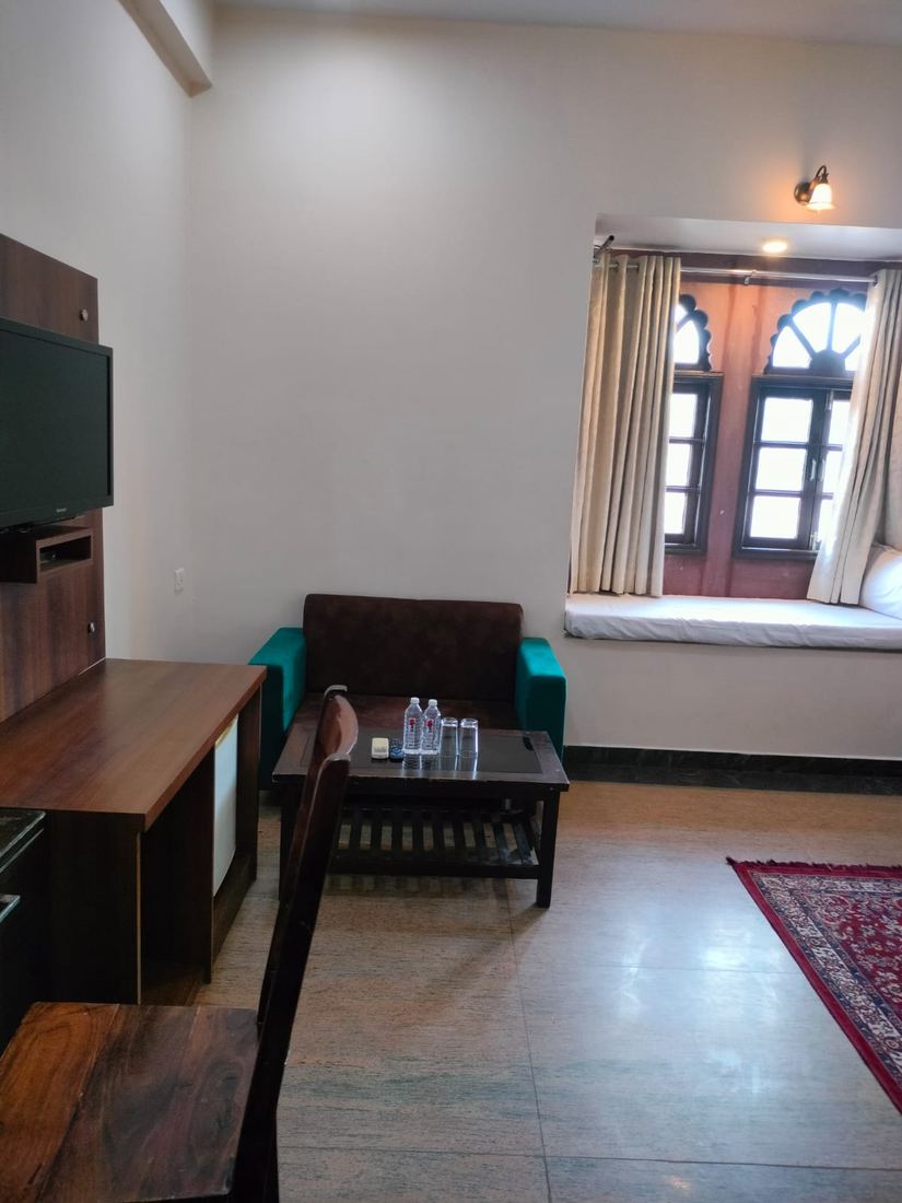 Sitting area inside a room at Garh Govind